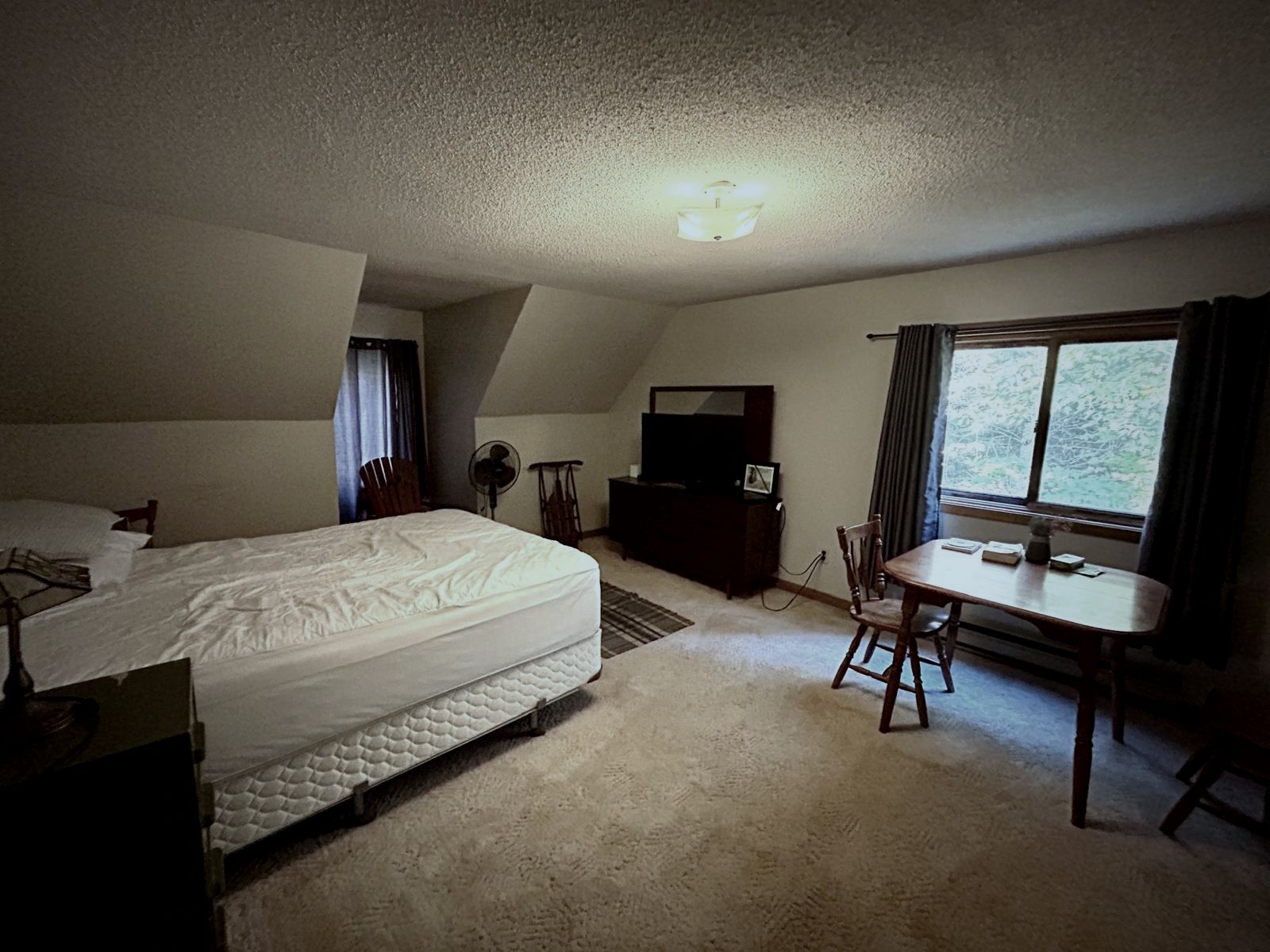 Upstairs bedroom under a sloped ceiling